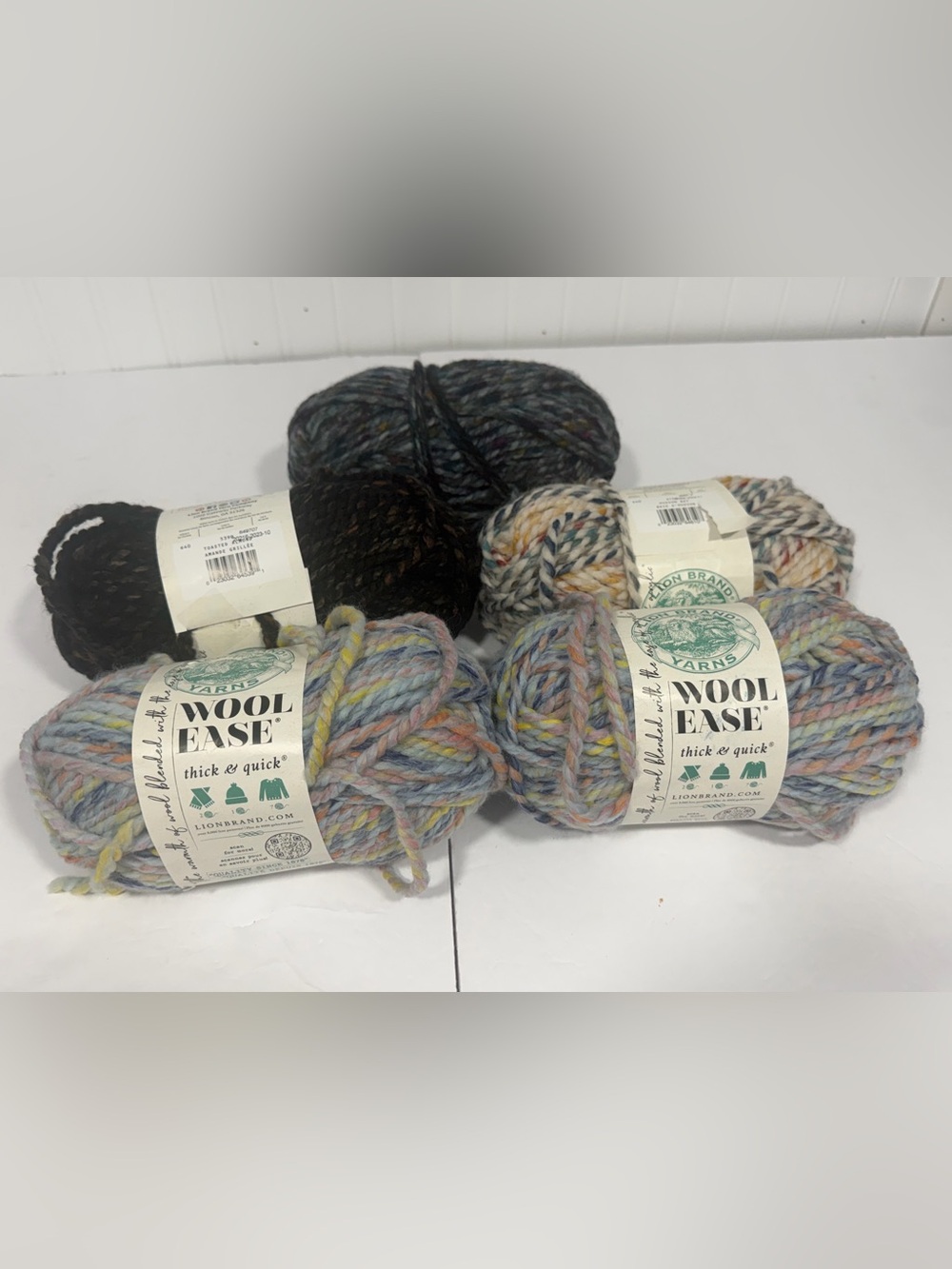 Lion Brand Wool Ease Thick & Quick yarn bundle. 4 skeins of multicolored yarn